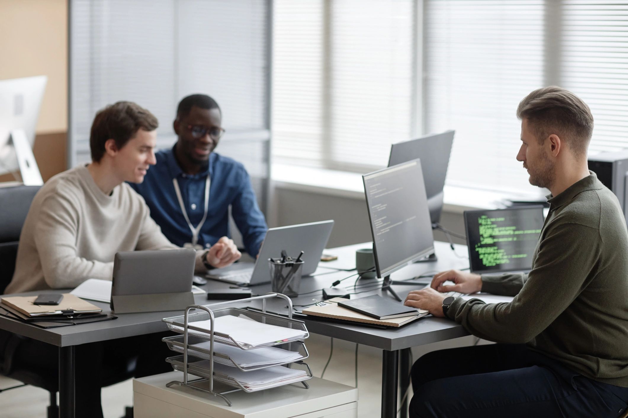 Technology professionals working together in an office